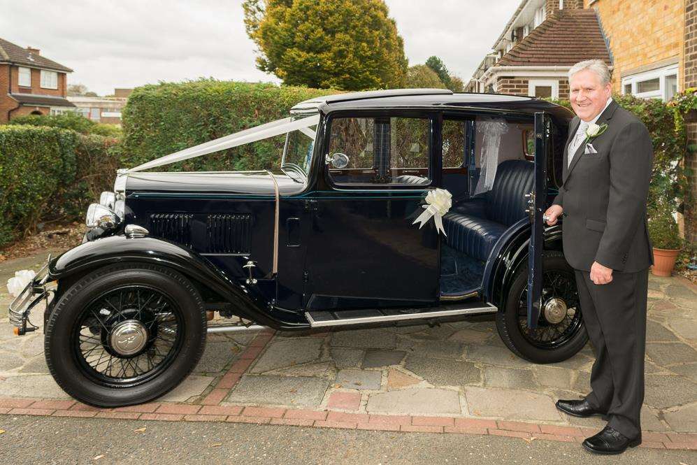 Wedding singer John Butcher with his vintage Austin. Picture: Hayes and Kent Wedding and Event photography