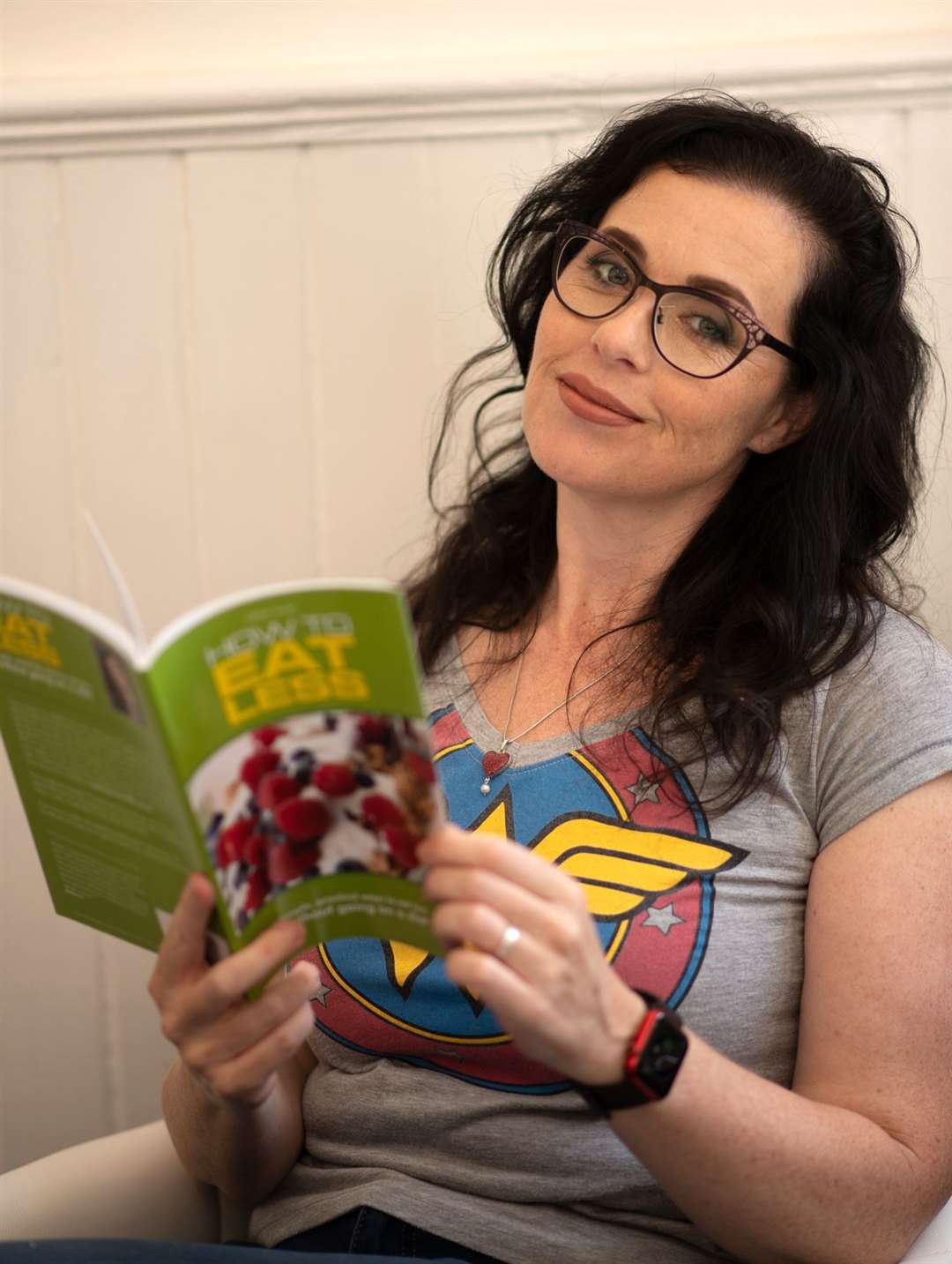 Mrs Jones with her book How To Eat Less. Picture: Rapture Group