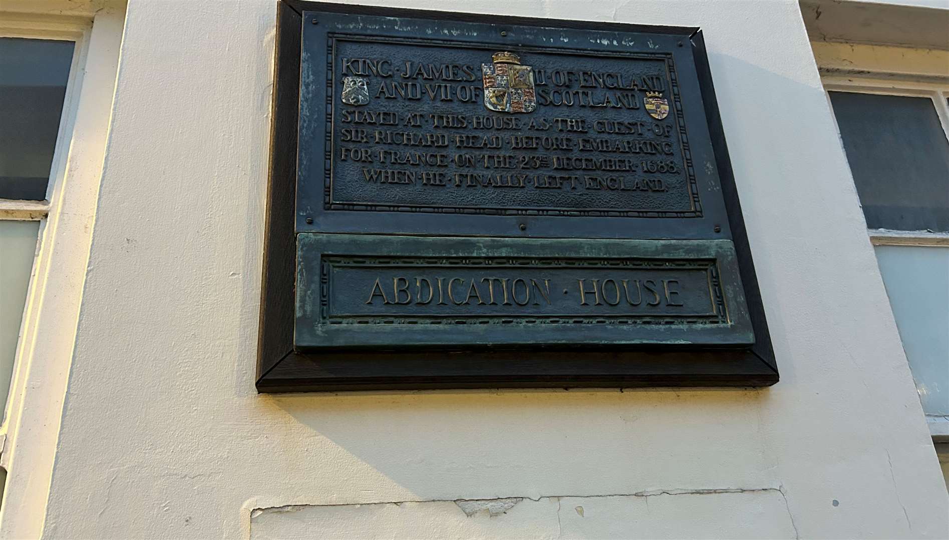 Inscribed plaque outside the historic building where James II once stayed