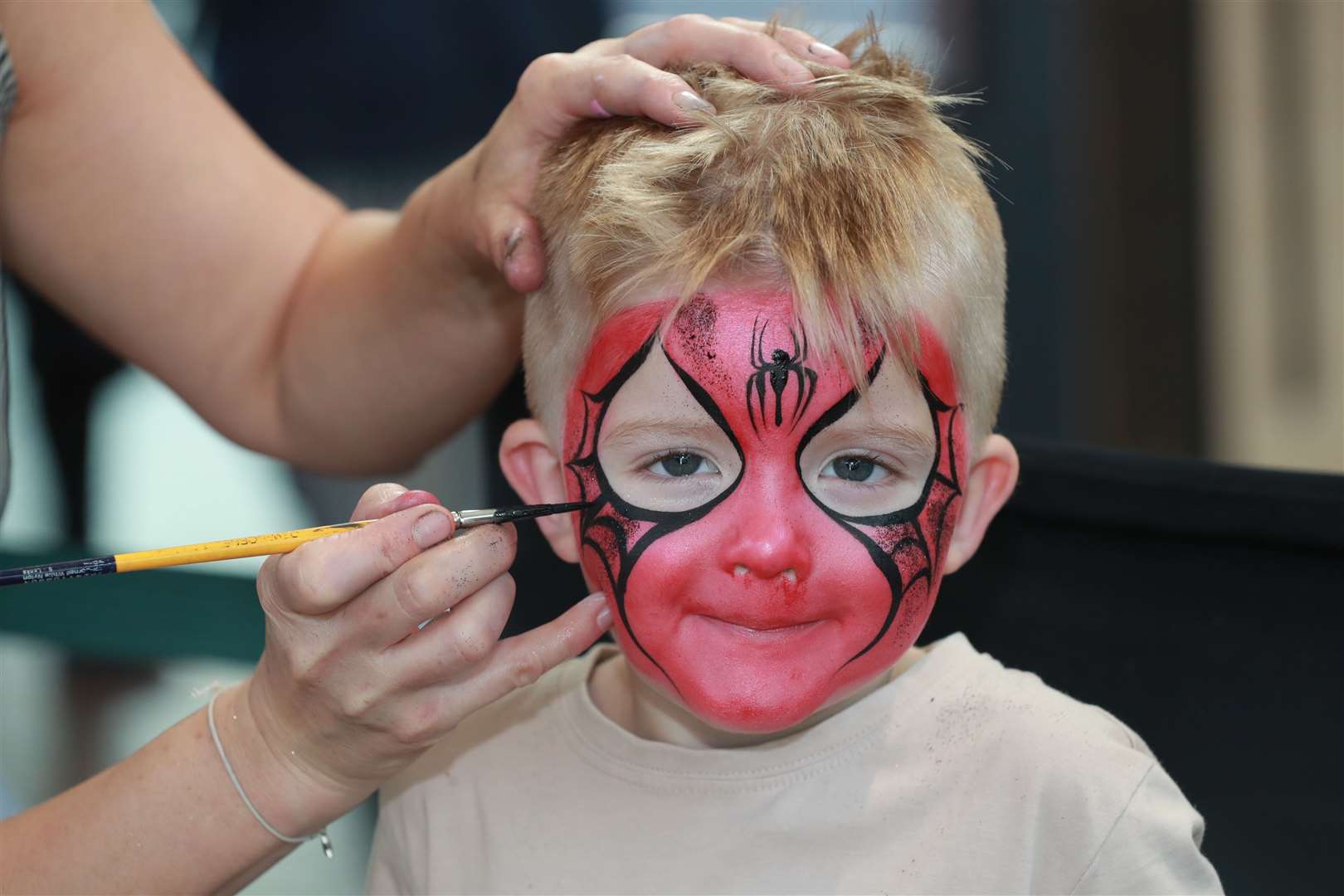 Ronnie Ward, four, gets his face painted at Hempstead Valley Shopping Centre. Picture: John Westhrop