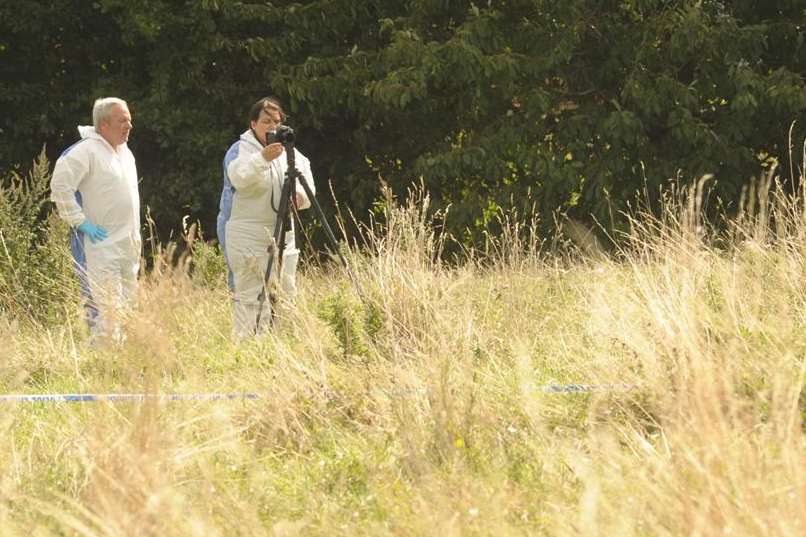 Forensics officers work at the scene were a man was stabbed. Picture: Steve Crispe
