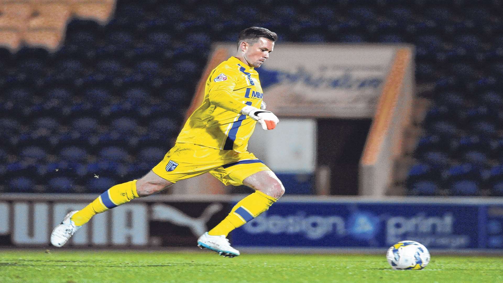 Stuart Nelson takes Gills' crucial fourth penalty against Colchester Pic: Barry Goodwin