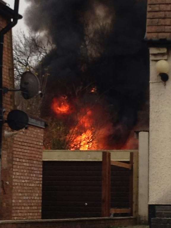 A fierce fire erupted in the Cruden Road shed. Picture: Maxine Springett