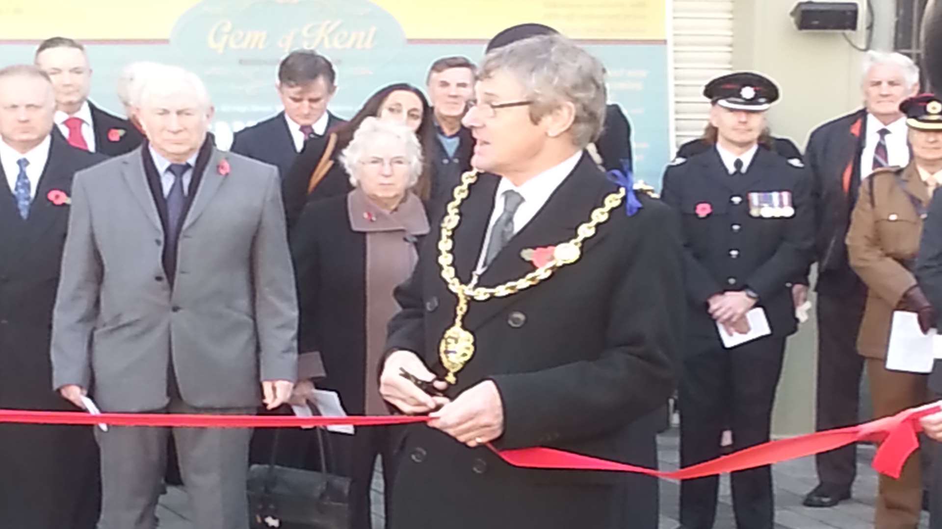 The Mayor cuts a ribbon to open the square