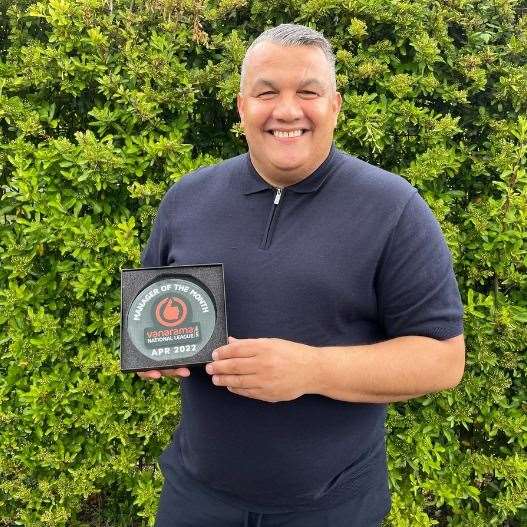 Maidstone boss Hakan Hayrettin with his manager-of-the-month award for April
