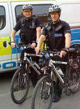 PC Andy Rogers (left) and PC Simon Clarke arrested a man on suspicion of burglary after cycling to the scene on police push bikes