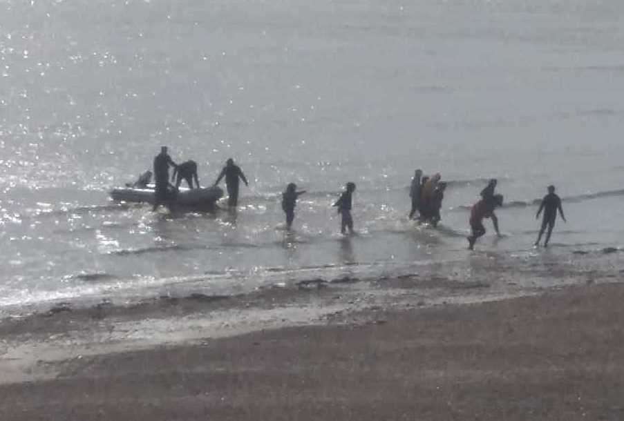 Up to 16 people were pictured coming ashore via small boat at Kingsdown in September. Picture Christian Thrale