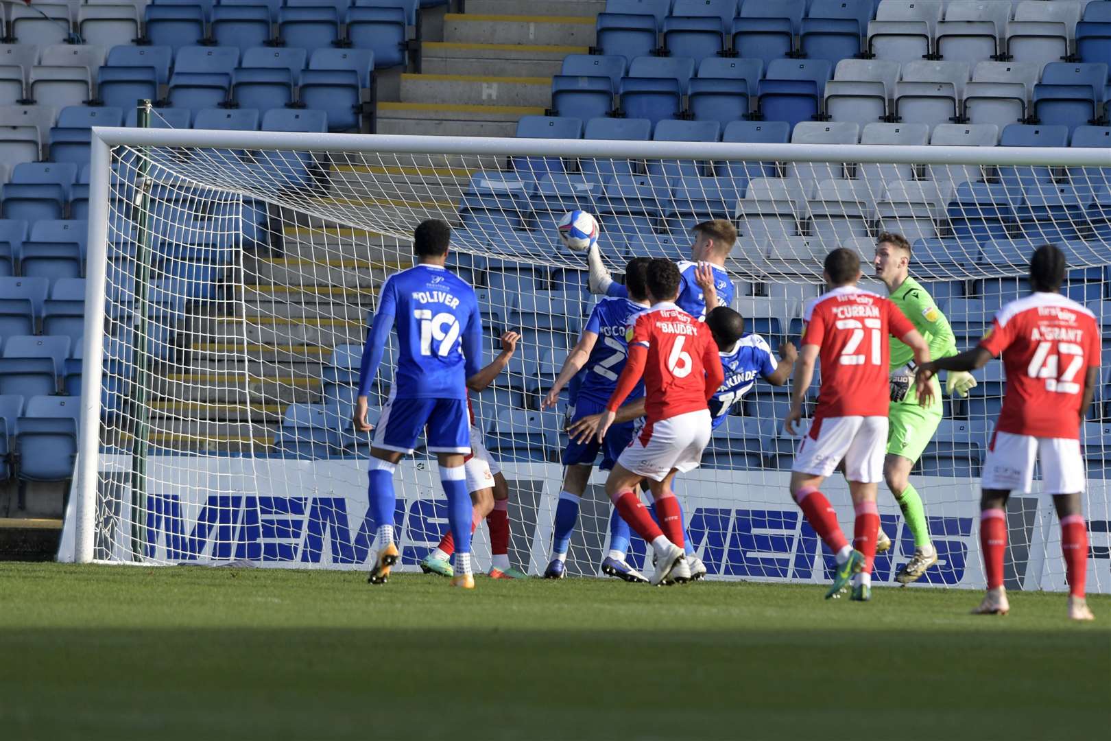Gillingham clear the danger as Swindon threaten the goal Picture: Barry Goodwin