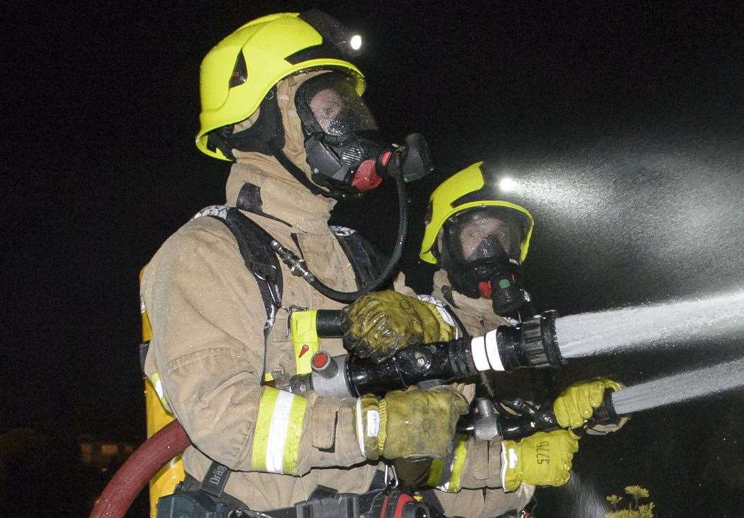 Firefighters wearing breathing apparatus tackled the blaze. Stock picture