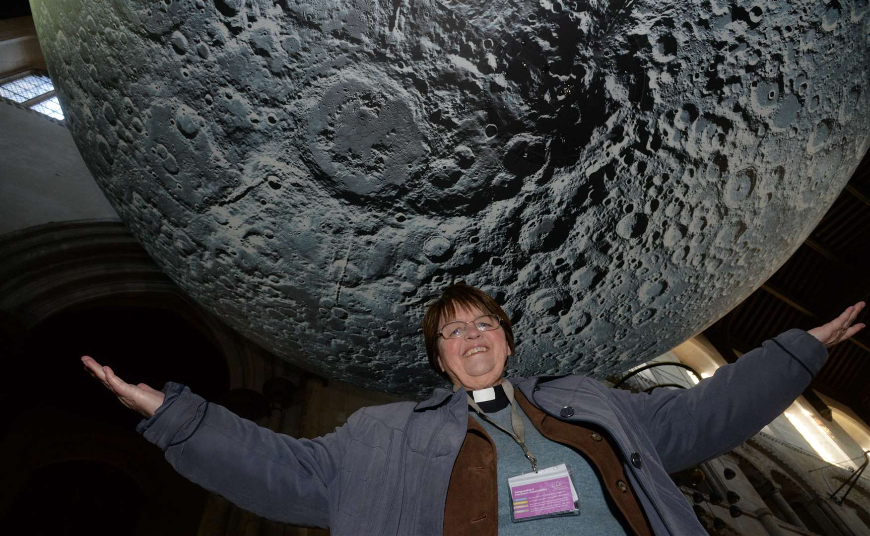 Canon Sue Brewer with the Moon on the first day of the exhibition in Rochester Cathedral Picture: Chris Davey