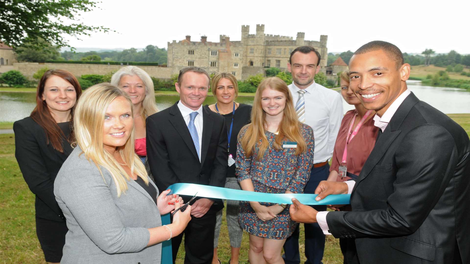 KM Walk to School supporters celebrate the start of walk to school month by cutting a ribbon at Leeds Castle. Front: Helen Critcher (Golding Vision) and Eric Hodges (Orbit South) with Countrystyle Recycling, Kent County Council, Medway Council and Three R’s Teacher Recruitment.