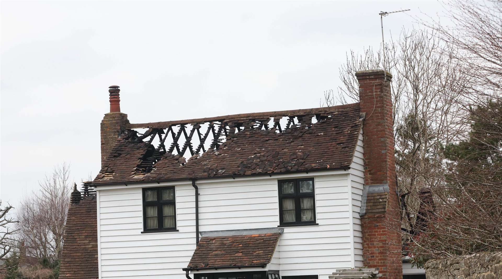A nearby home was seriously damaged after the blaze. Picture: UKNIP