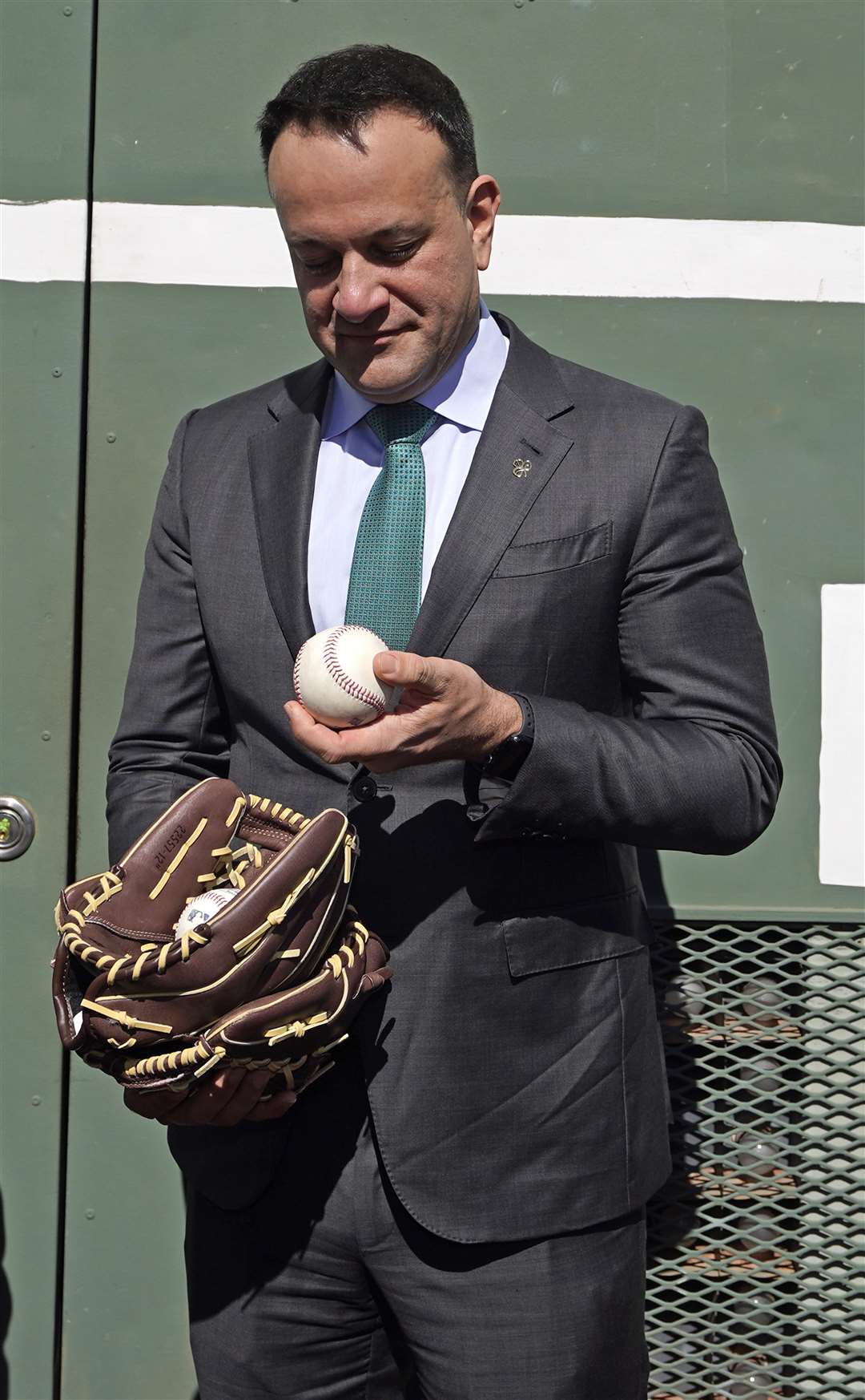 Taoiseach Leo Varadkar is presented with a ball and mitts (Niall Carson/PA)