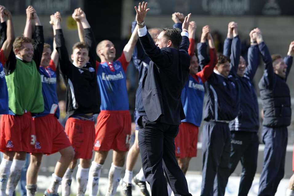 Manager Martin Allen celebrates the League 2 title with his players. Picture: Barry Goodwin