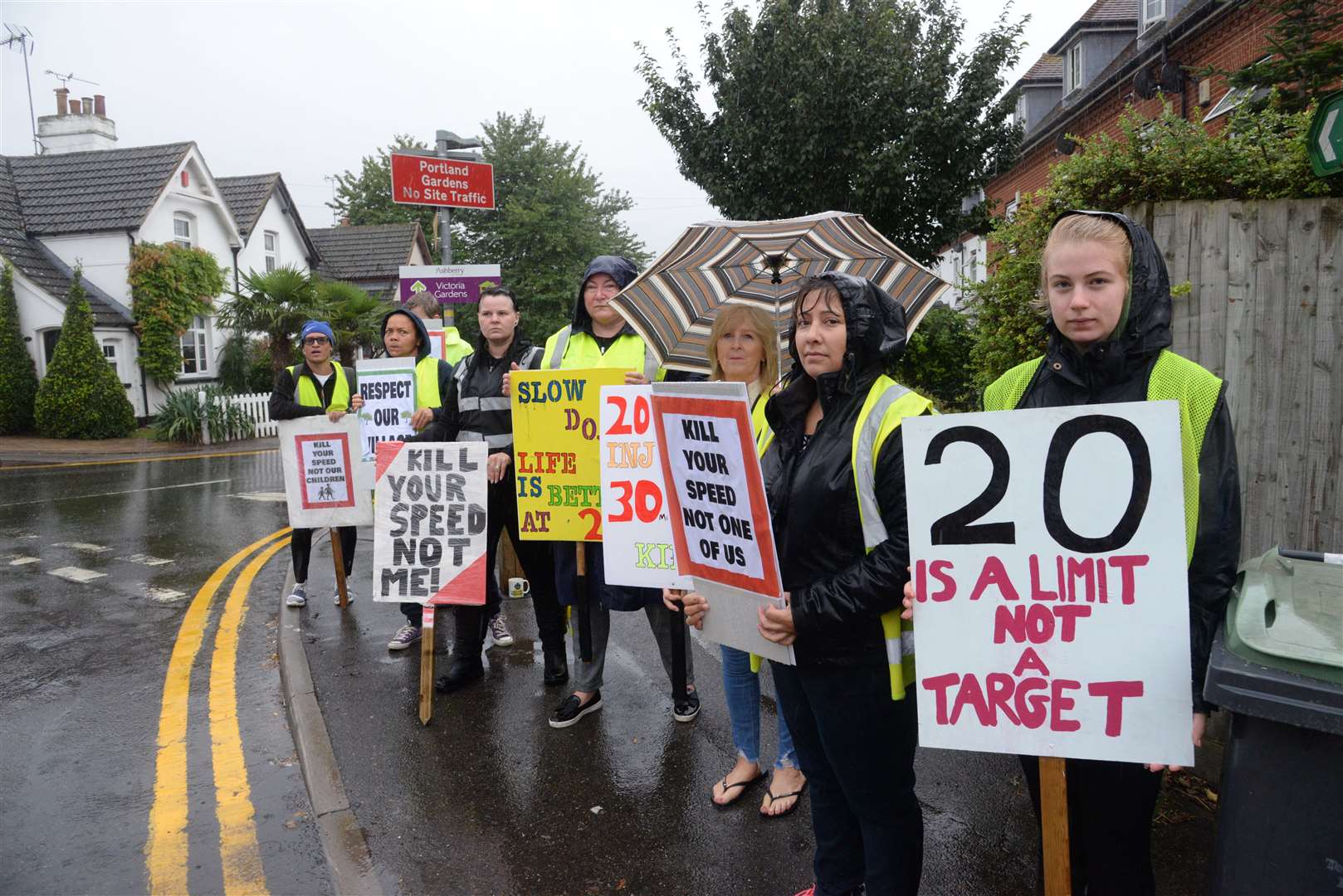 Residents line the street in Wouldham to protest against traffic on Wednesday morning. Picture: Chris Davey. (16109540)