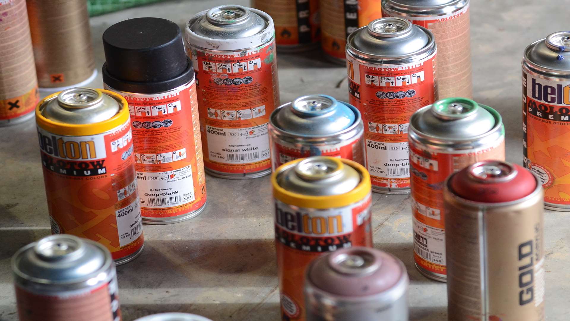 Tins of spraypaint. Stock image