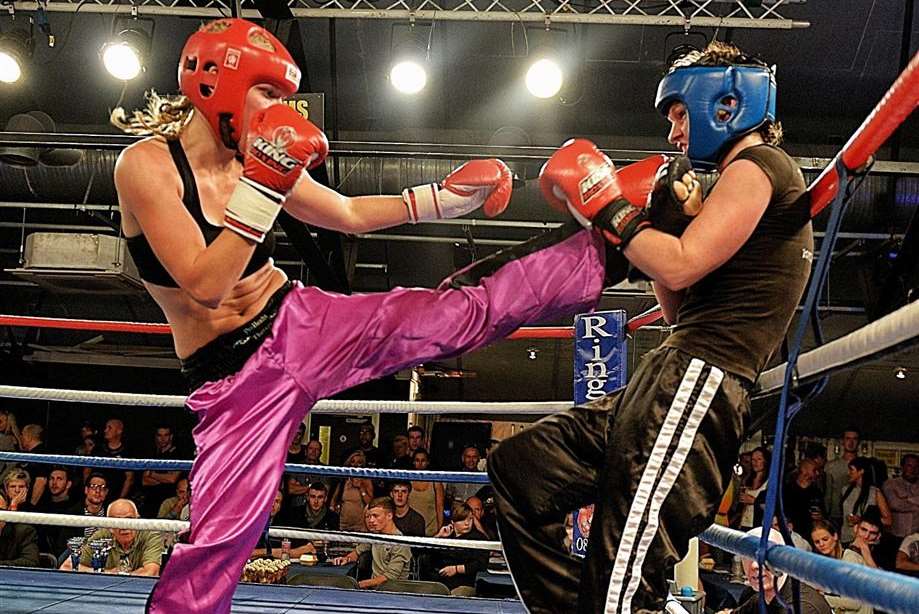 Kelly Copeland lands a kick to her opponent at the Casino Rooms