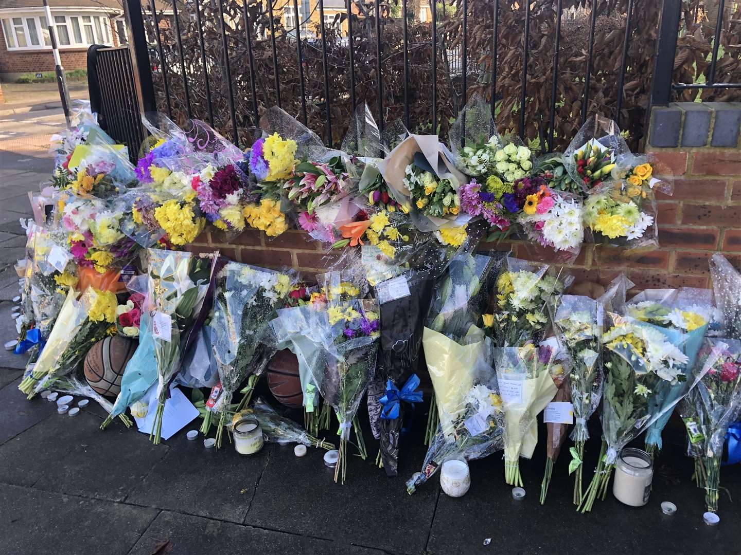 Floral, candle and basketball tributes were laid for Szymon
