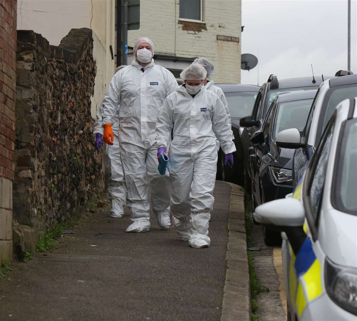 Forensics officers in Hamerton Road. Picture: UKNIP