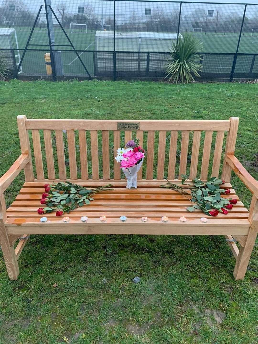 The memorial bench for Liam with flowers left.Picture:Mark Evans