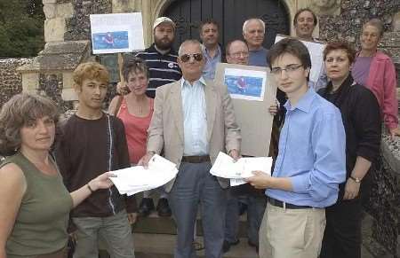 Cllr Ron Pepper accepts the petition from Kate Adams, Abrahim Ramini and Tom Hancox