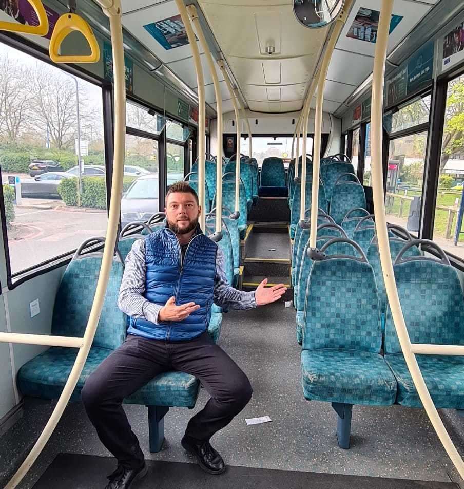 Cllr Peter Holmes illustrating his point in an empty bus