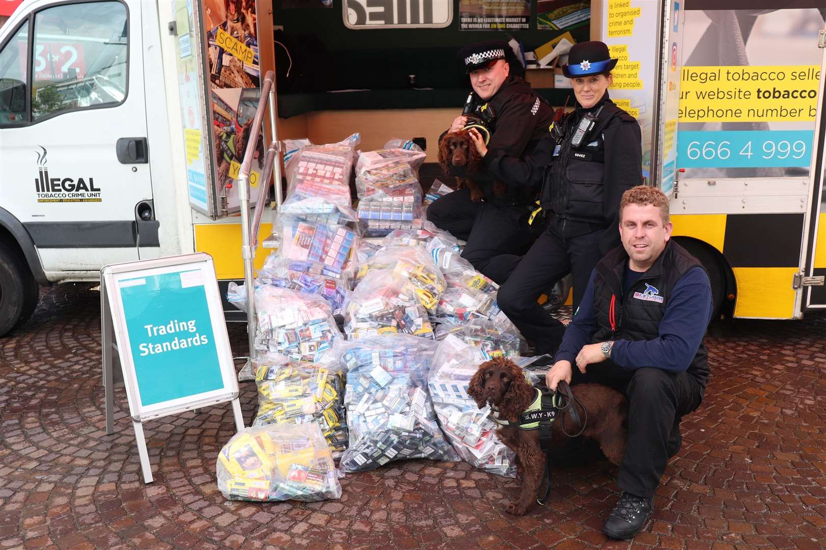 Officers with the illegal cigarettes and tobacco finds