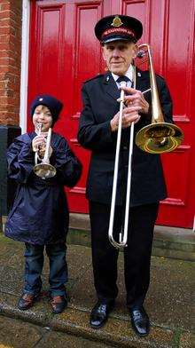 Veteran bandsman George Neeve with the group's youngest new member, Bailey Kite, eight.