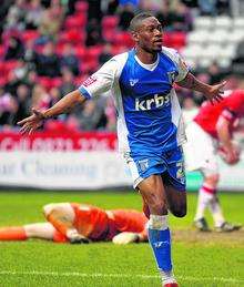 Gillingham striker Dennis Oli celebrates after scoring Gills' second in the 2-2 draw against Chartlon at the Valley