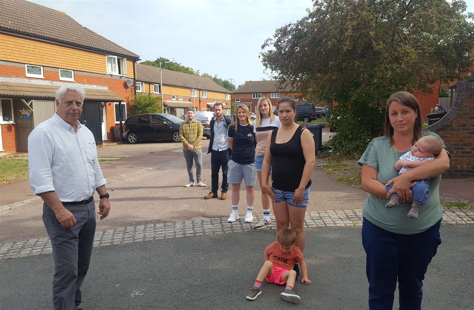 Cllr Dave Wilson (left) with families facing eviction