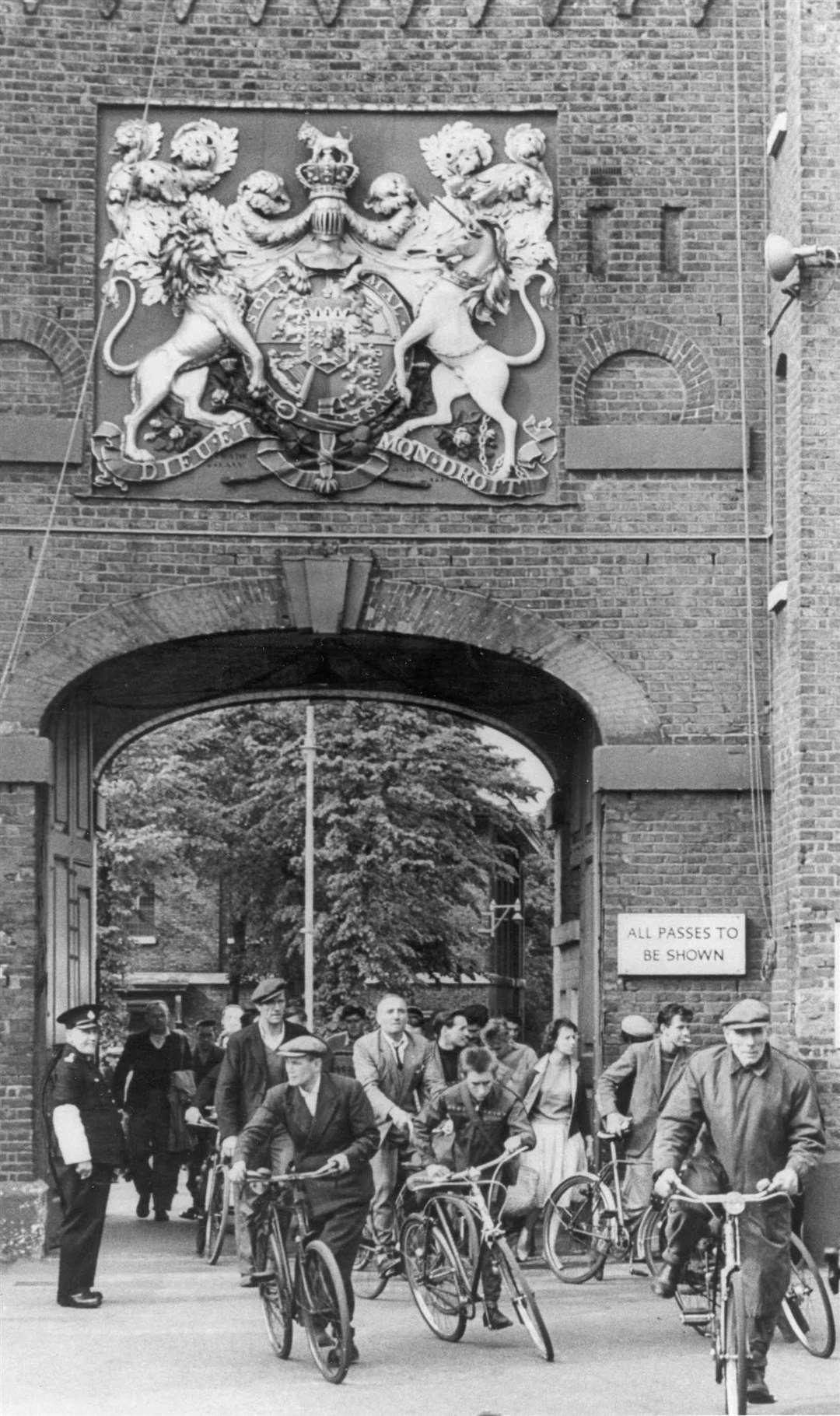 Dockyard workers leaving the premises in 1960