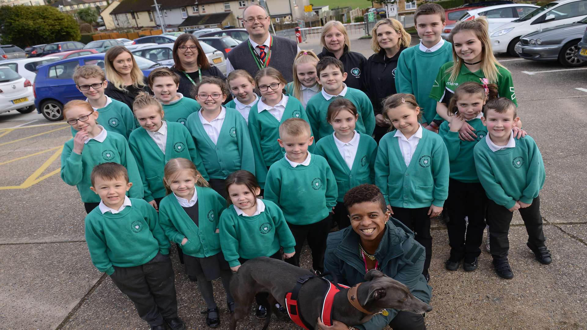 Staff and pupils at Green Park primary school in Dover and school dog Jacq.