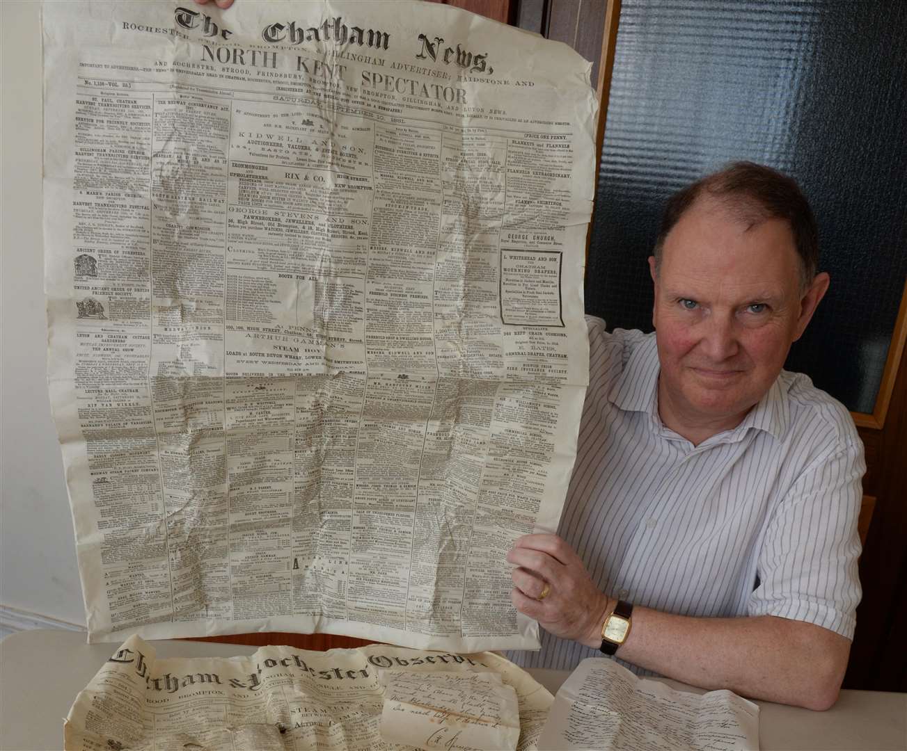 Rev Stephen Greasley with the contents of the time capsule dating back to 1881