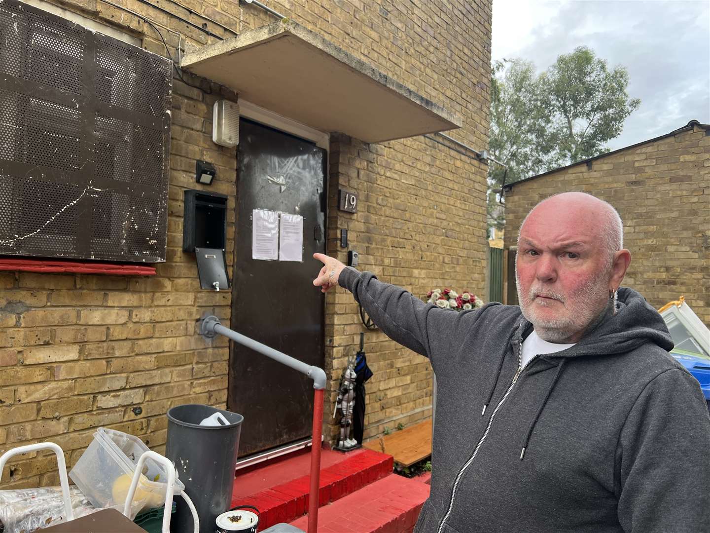 Philip Webb of Oak Road, Murston pointing at the flat that received a closure order from police