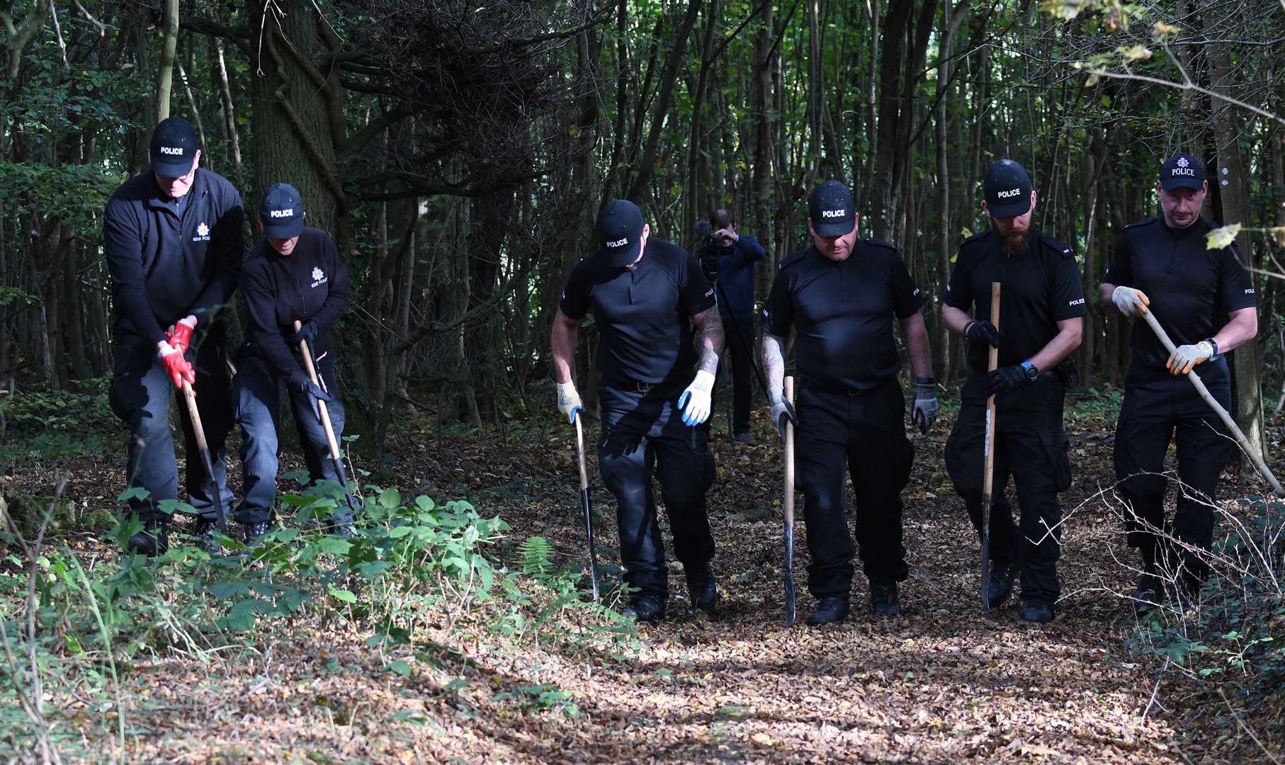 Officers have today been searching more areas of woodlands. Picture: Steve Finn
