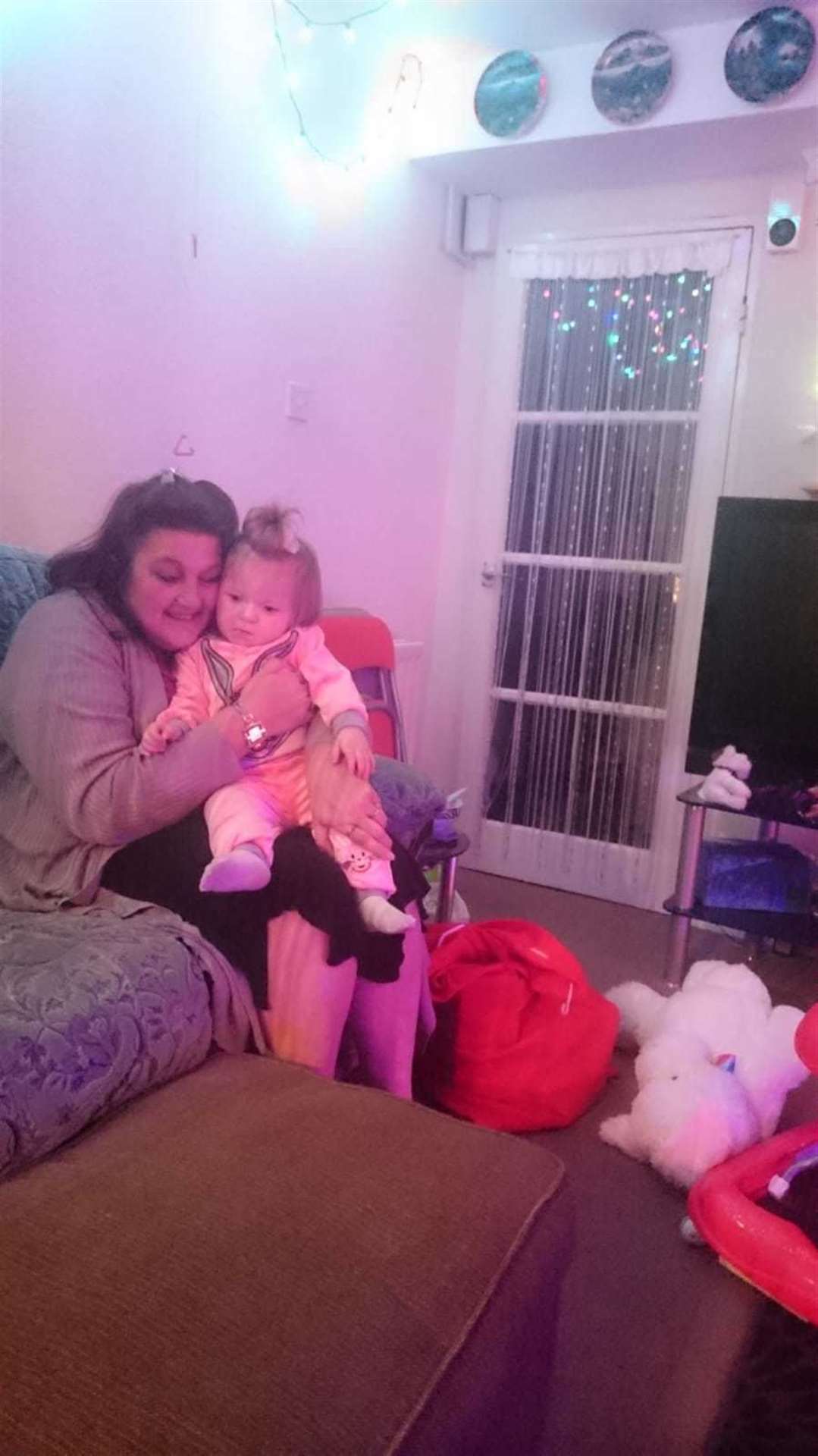 Debbie West in her flat with her granddaughter (11796728)
