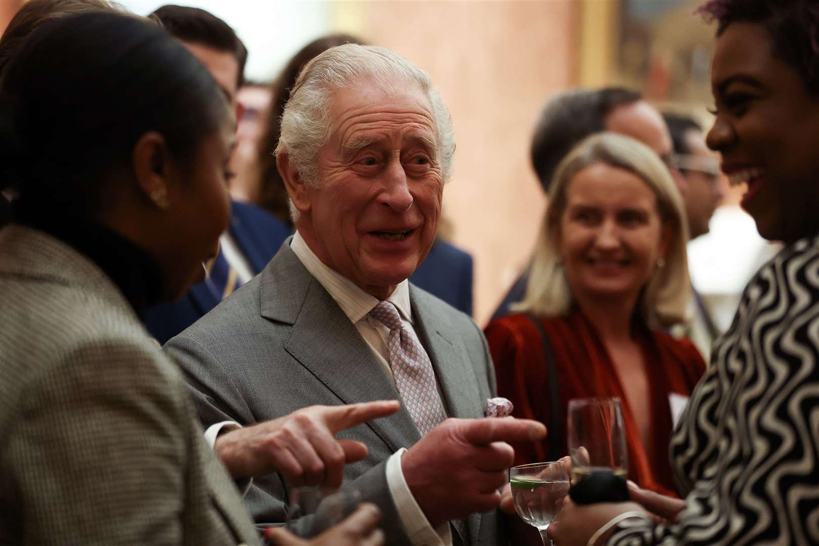 The King speaks to guests during a reception at Buckingham Palace (Isabel Infantes/PA)