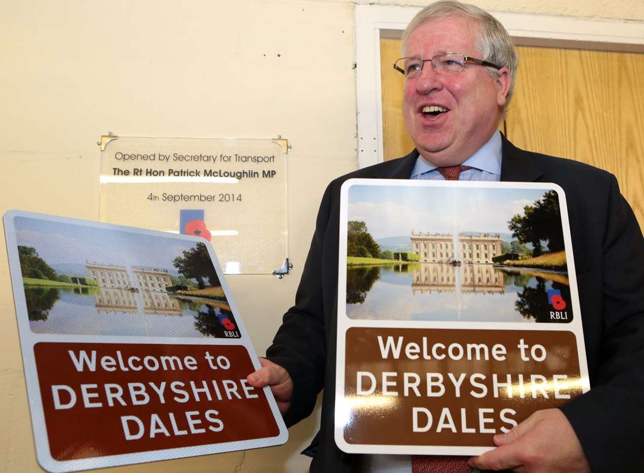Transport Secretary Patrick McLoughlin with the new style of tourism road sign