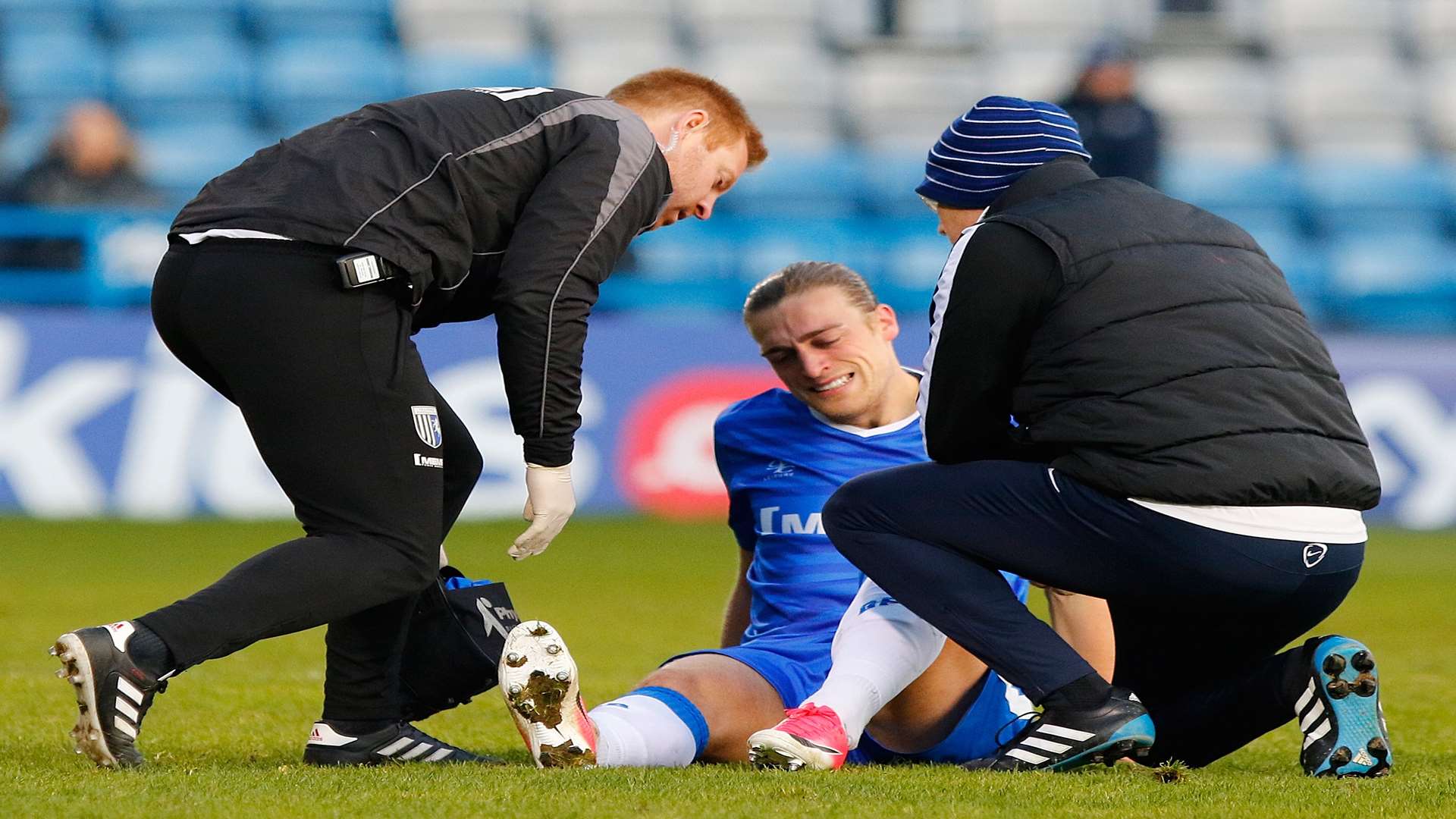 Gills striker Tom Eaves gets some treatment. Picture: Andy Jones