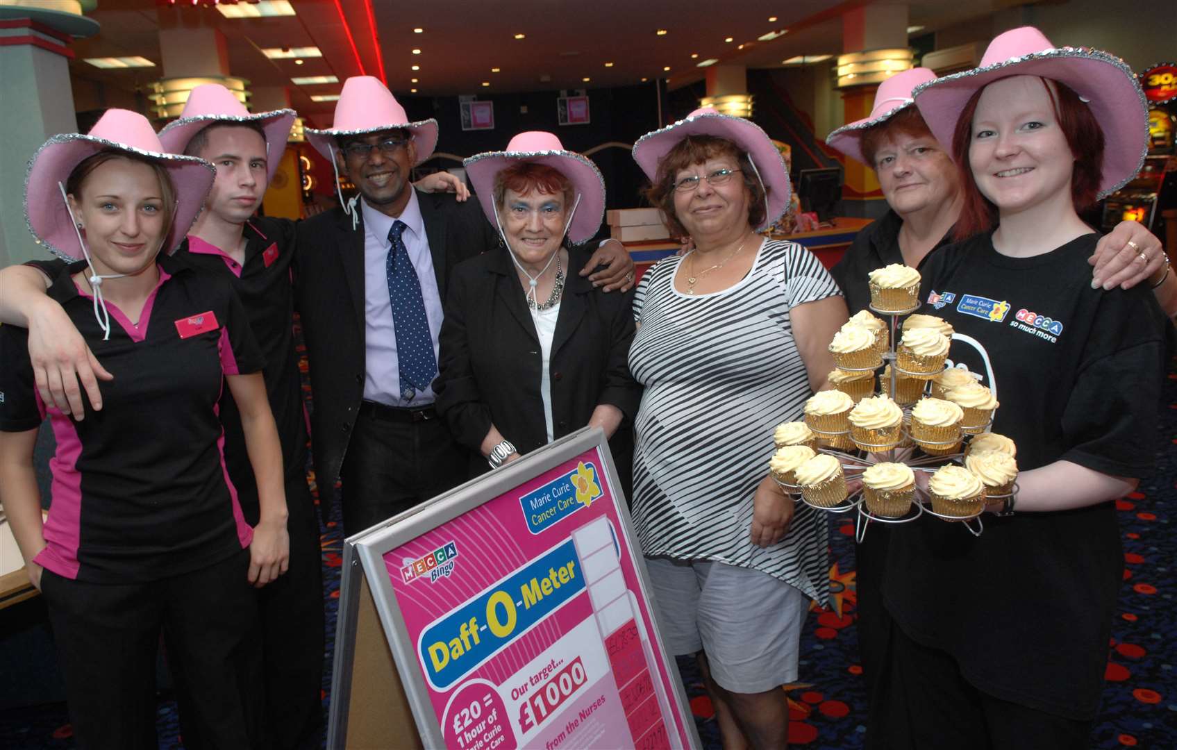 Staff and customers at a Mad Hatter's tea party in aid of Marie Curie in 2010