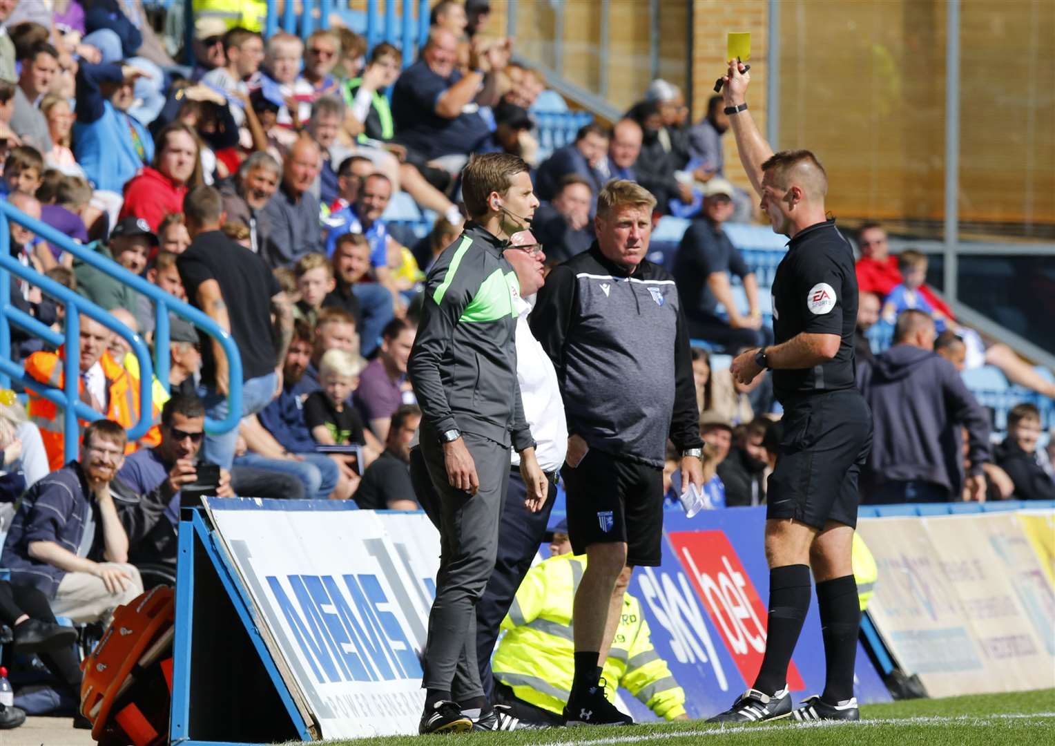 Referee Thomas Brammall show Gillingham boss Steve Evans a yellow card. Picture: Andy Jones (49990658)