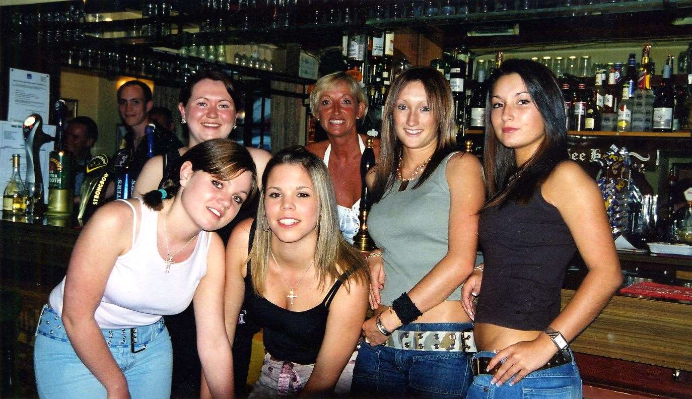 Wendy Ireland, proprietor of See Ho pub in Shorne, Gravesend, is pictured behind the bar with the girls who work as bar staff in June 2003. The pub is still in business today