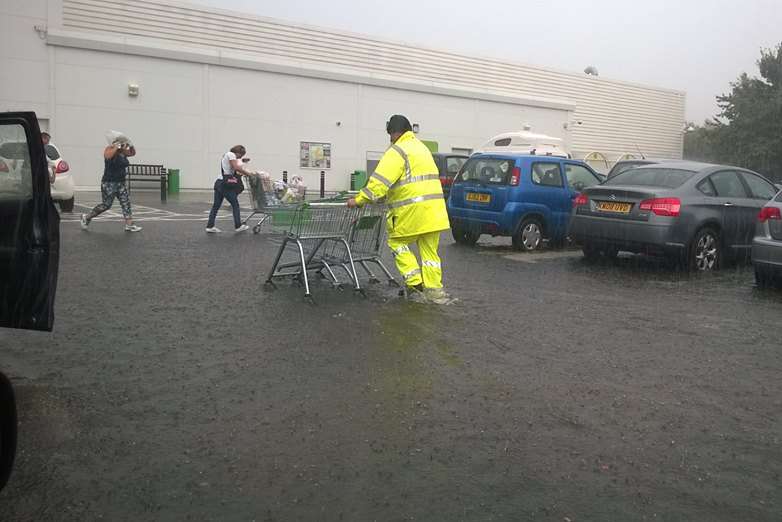A shopper braves the rain at Asda Sittingbourne. Photo from Gavin Crawford