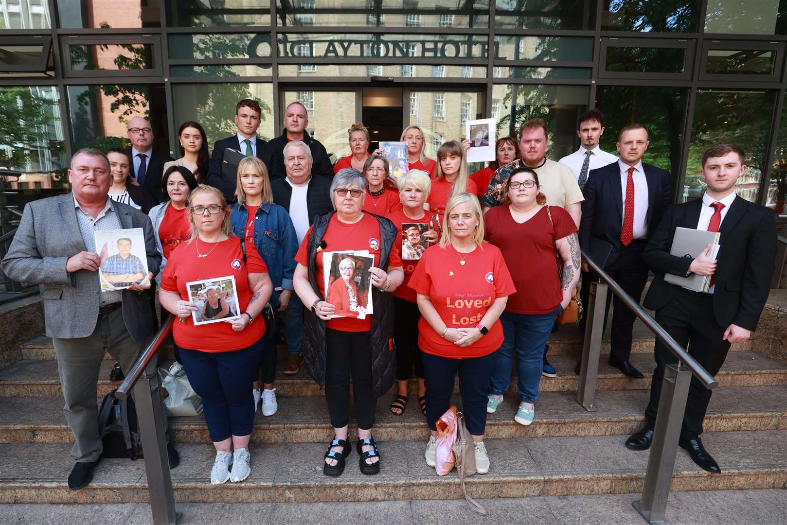 Members of Northern Ireland Covid-19 Bereaved Families for Justice hold a press conference outside the Clayton Hotel in Belfast (Liam McBurney/PA)