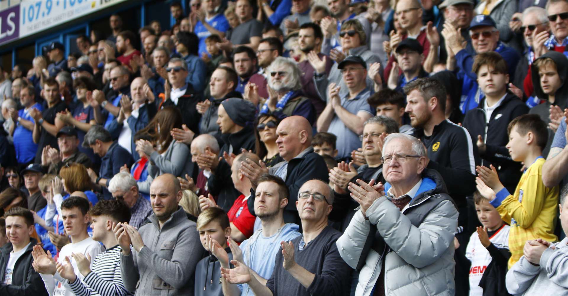Gills fans take part in a minute's applause in memory of Ray Wilkins prior to kick-off. Picture: Andy Jones