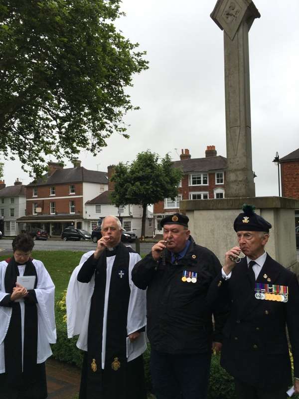 Canon Lindsay Hammond of St Mildreds Church and ex-servicemen blow symbolic whistles to commemorate the centenary of the start of the Battle of Somme