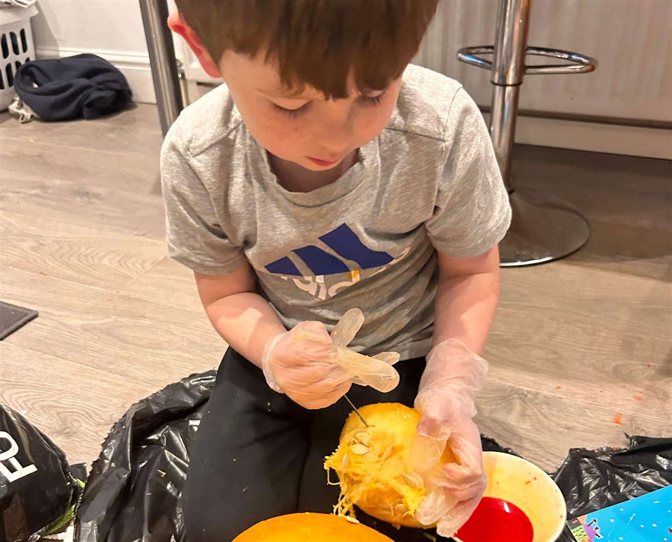 It was his first time carving his own pumpkin