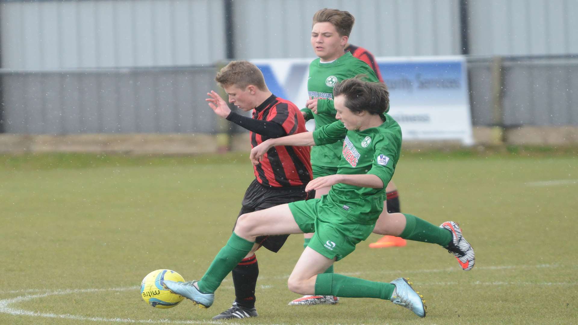 Meopham Colts, red, get ahead of New Ash Green in the Under-16 John Leeds Trophy final Picture: Gary Browne