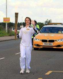 Becca Hoggett carried the Olympic torch in Canterbury Road East, Ramsgate. Picture by David Carr