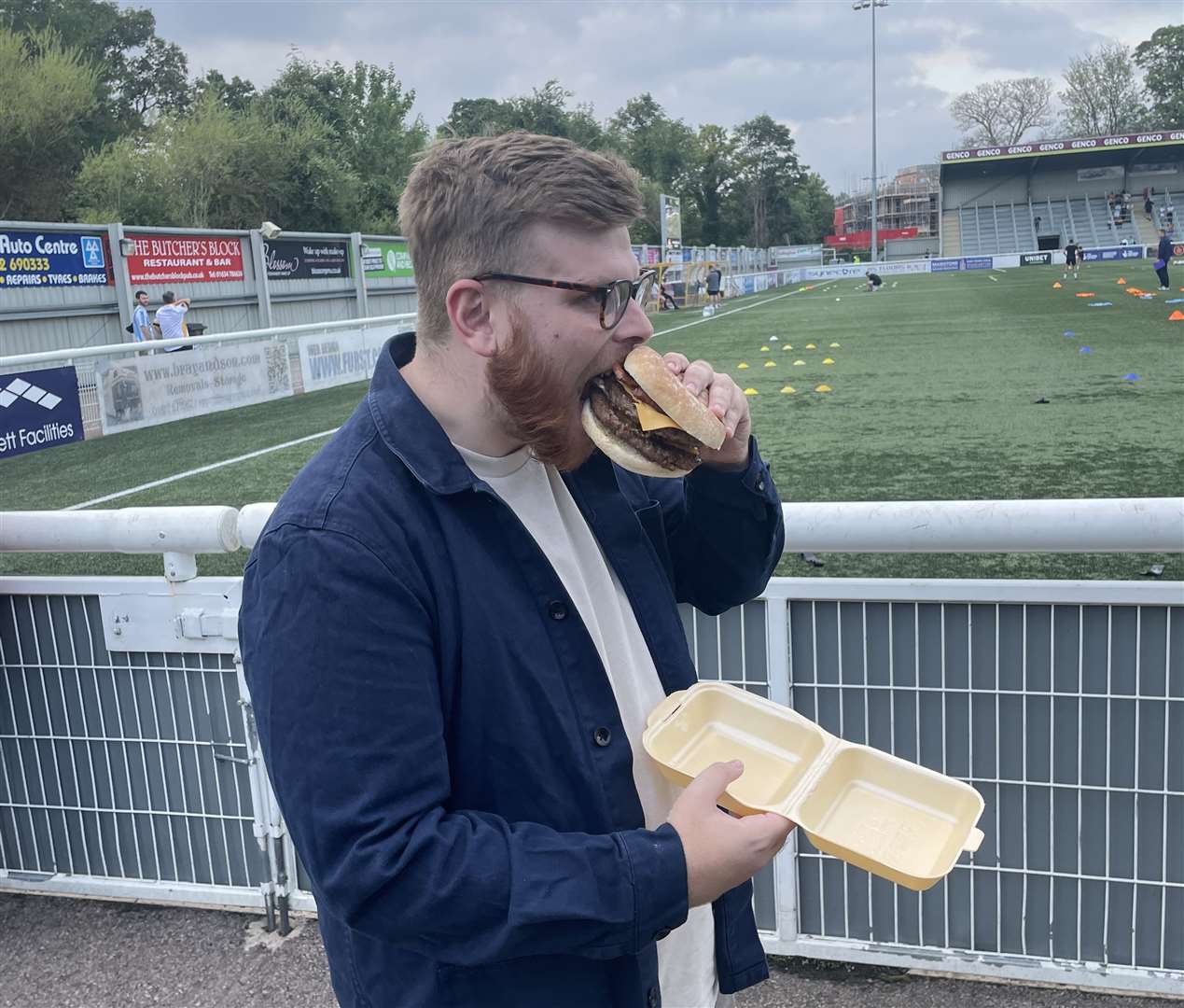 Reporter Sean McPolin tucks into a bacon double cheeseburger ahead of kick-off